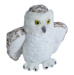 A plush toy resembling a snowy owl with white and brown feathers, and yellow eyes.